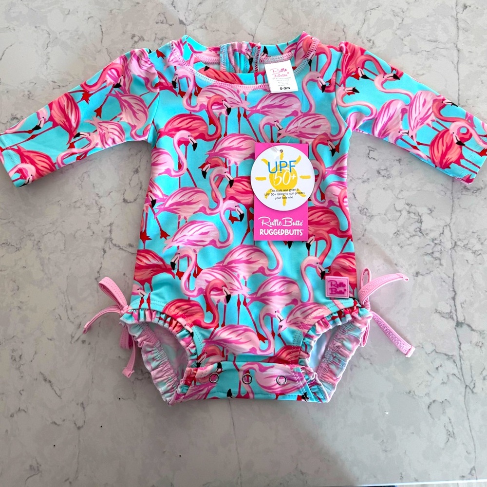 NWT RUFFLE BUTTS Fab Flamingo🦩 One Piece Rash Guard Swim Suit